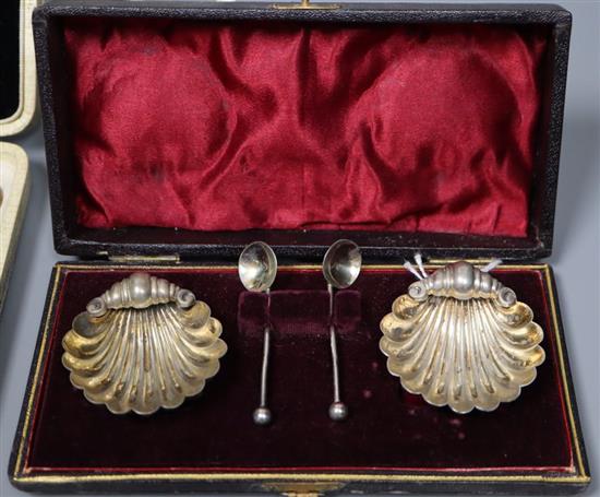 Sundry silver items, including a modern sterling pap boat, a pair of dwarf pillar candlesticks, a pair of shell salts and spoons,